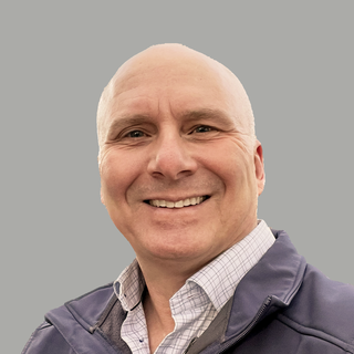 A portrait photograph of Mark Colby