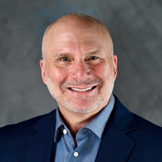 A portrait photograph of Mark Colby